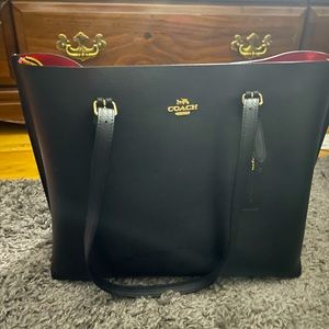 Beautiful coach bag. Leather with all red interior. 3 compartments. Smoke free